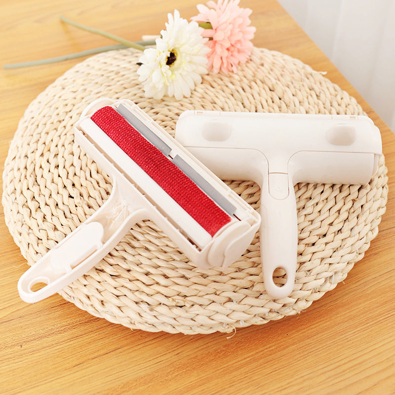 Cleaning tool with red roller on a woven mat with flowers