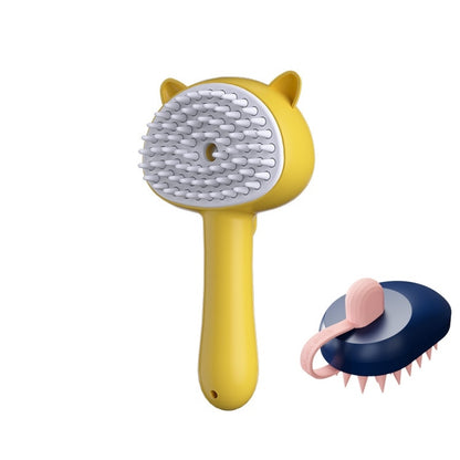 A yellow pet grooming brush with a cat-ear-shaped head and white silicone bristles, shown alongside a smaller inset view of a navy blue brush with pink silicone teeth.
