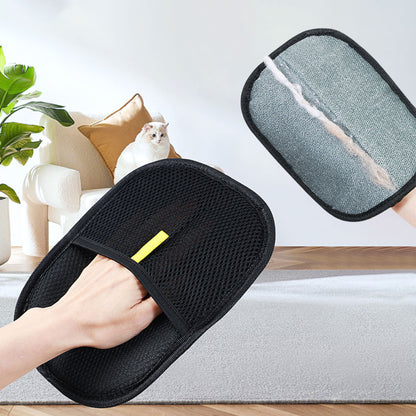 Black mesh slippers with a yellow tag, one worn by a person, the other held, in a home setting.