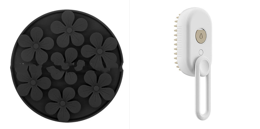 Black silicone mold with flower shapes and a white handheld cleaning brush on a white background
