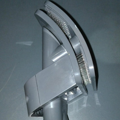 Gray handheld vacuum cleaner on a reflective surface