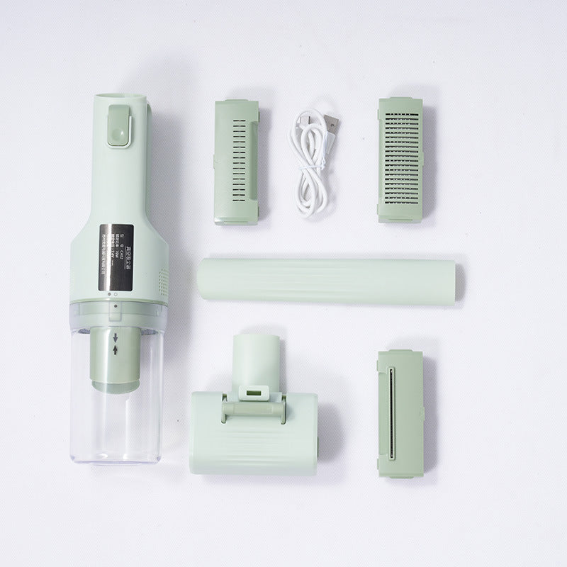 Set of green handheld vacuum components on a white background