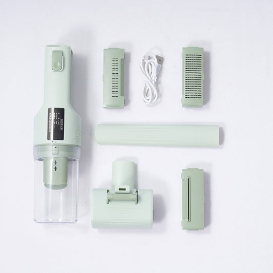 Set of green handheld vacuum components on a white background