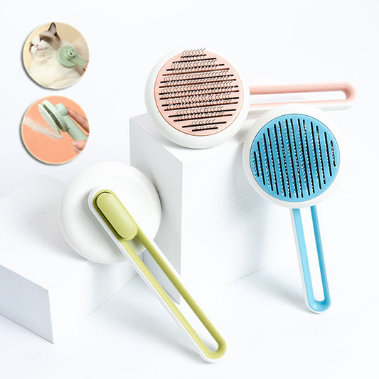 Three pet grooming tools in green, pink, and blue on a white background.