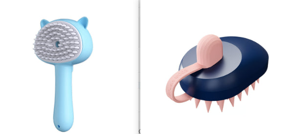Two pet grooming brushes shown side by side on a white background: a light blue cat-shaped brush with soft white bristles on the left, and a dark navy brush with pink triangular bristles and a pink handle on the right.
