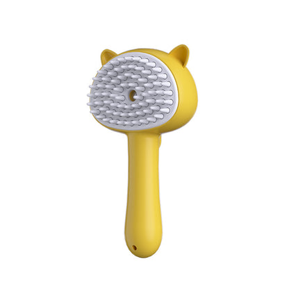 Yellow pet grooming brush with a white bristle head on a white background