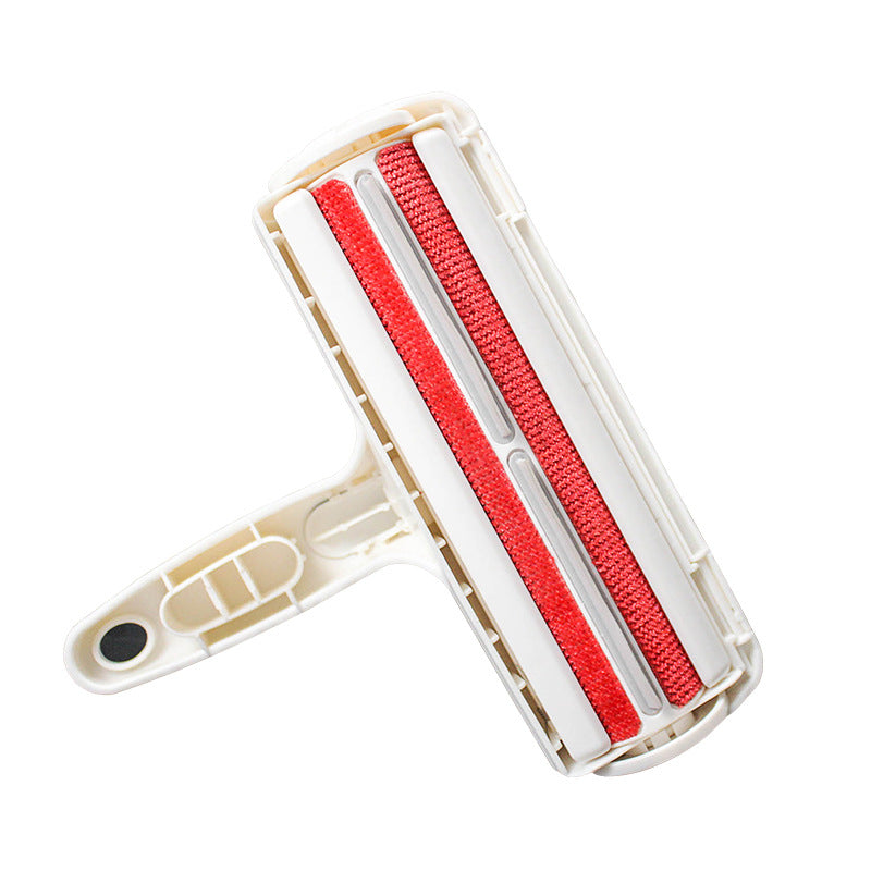 Cleaning roller with red bristles on a white background