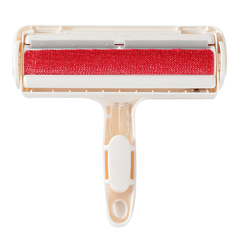 Red roller brush with beige handle on a white background