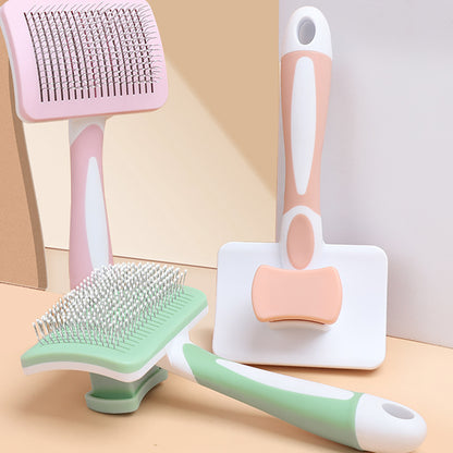Set of pet grooming tools including brushes and a comb on a neutral background