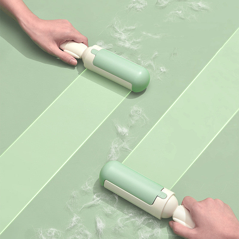 Green and white cleaning tool being used on a green tiled floor.
