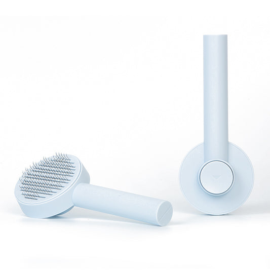 Two light blue grooming tools on a white background